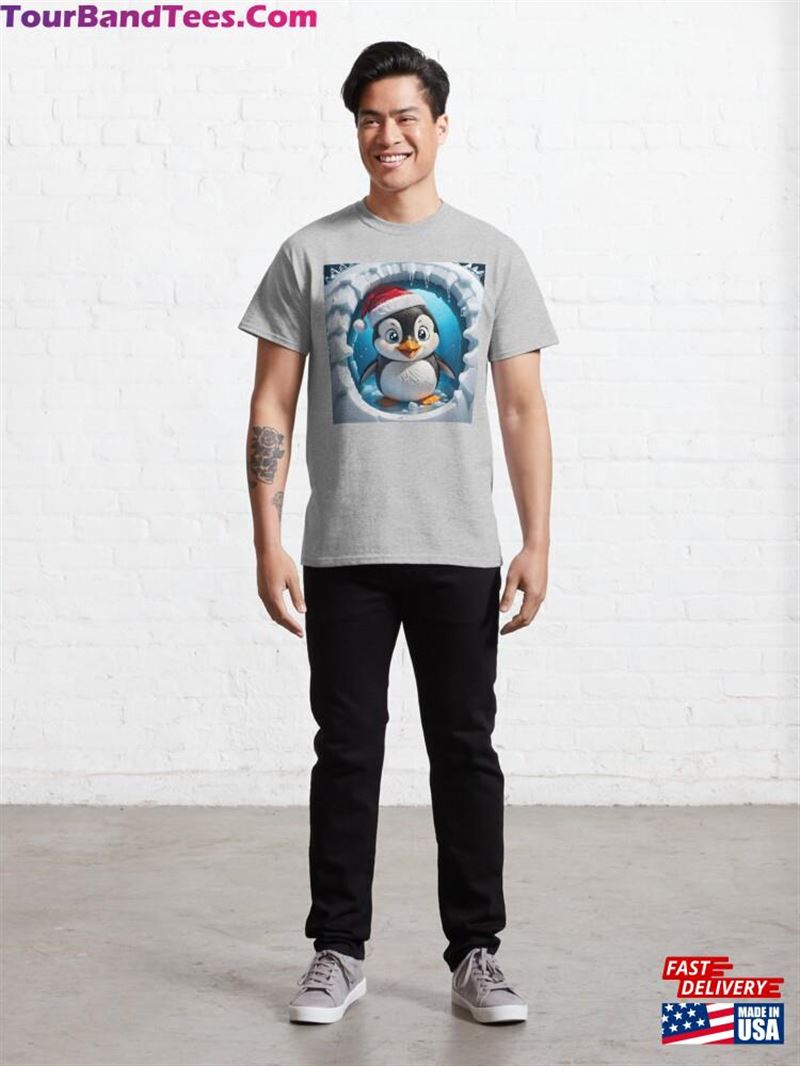 A Smiling Penguin In Santa Hat Jumping Out Of Round Cartoon Hole Through White Ice Cracked Wall Classic T-Shirt Unisex 29Uf211546 – Utopia Fashion